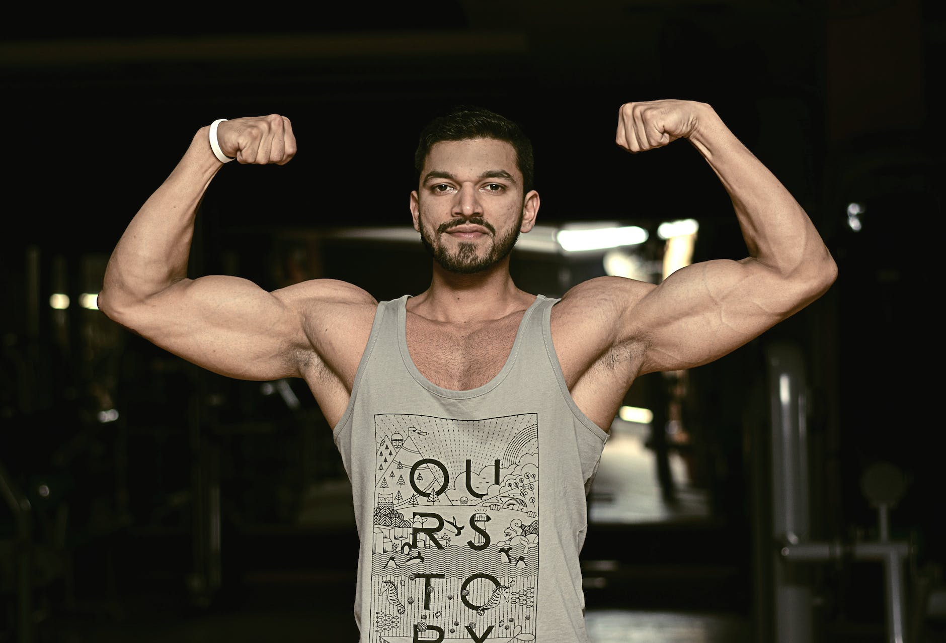 man wearing gray tank top